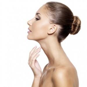 Model touching neck and under chin