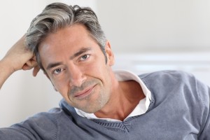 Handsome man relaxing in sofa at home