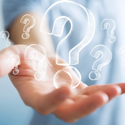 man holding question marks