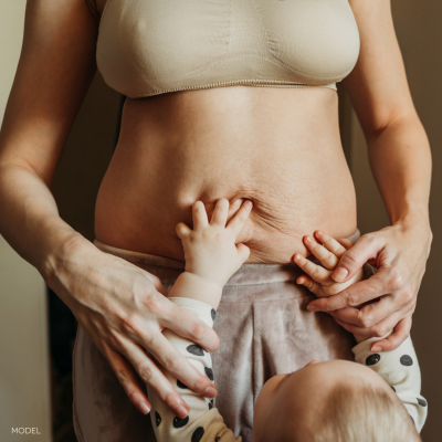 baby touching mom's stomach