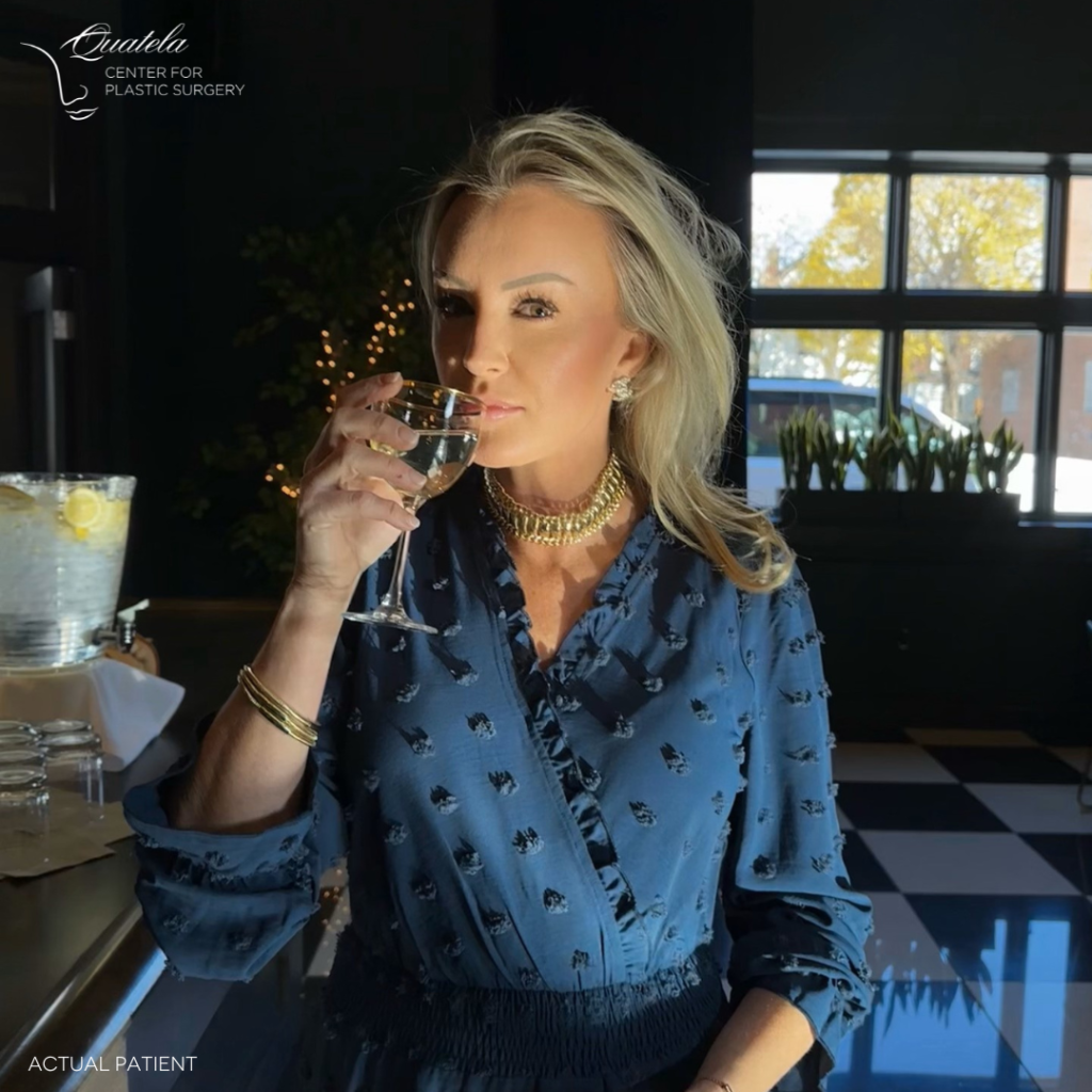 beautiful woman sitting inside restaurant at bar