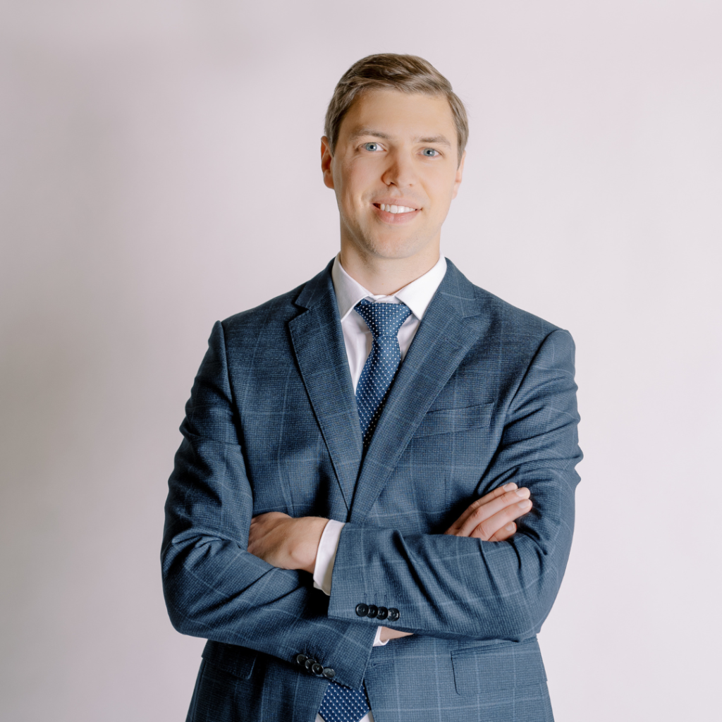 Dr. Peter Krasniak, arms crossed looking at the camera smiling